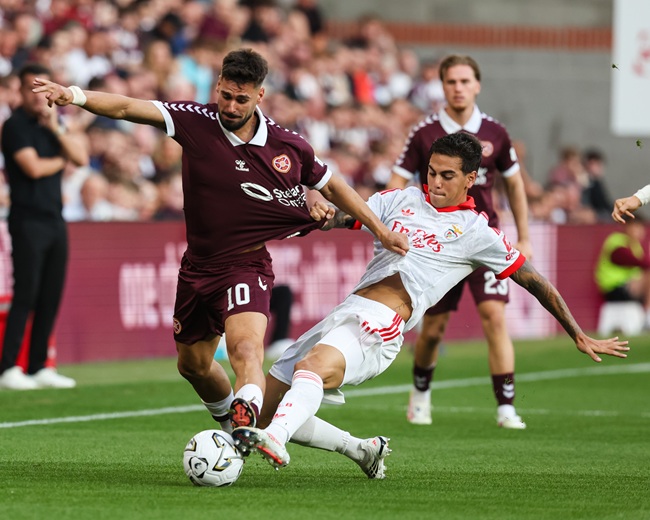 Hearts striker Cláudio Braga tussles for the ball with Benfica’s Enzo Barrenechea in the recent Champions League qualifier. (Photo: WM Sport Media/Getty Images)
